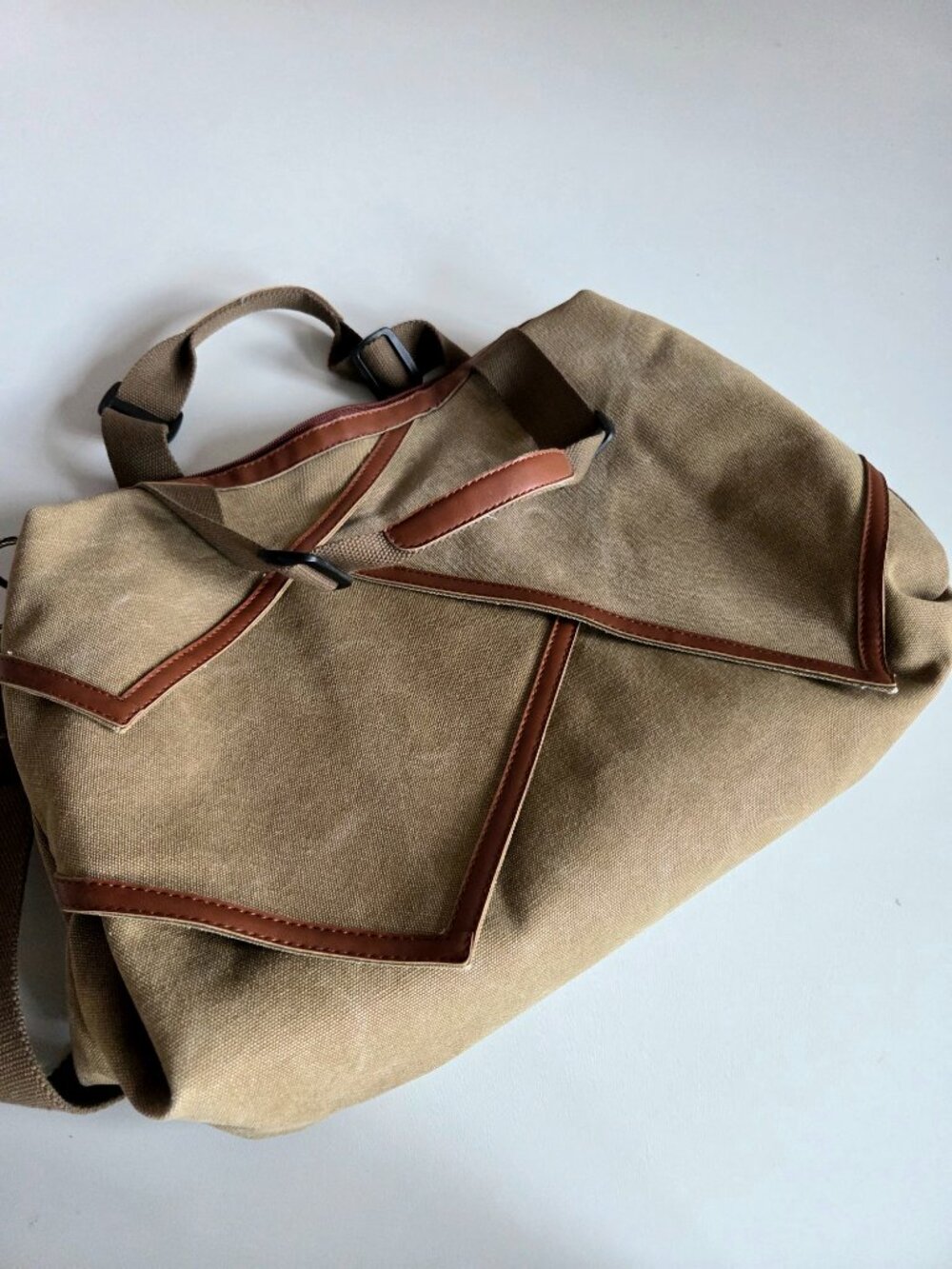 Oris large canvas crossbody bag with leather details.